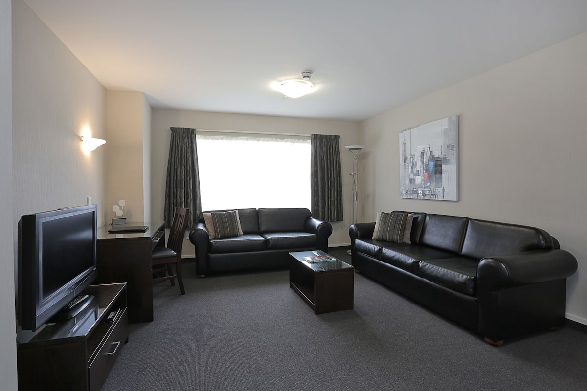Deluxe Apartment, 1 Bedroom, Jetted Tub | Living area | 55-inch Smart TV with satellite channels