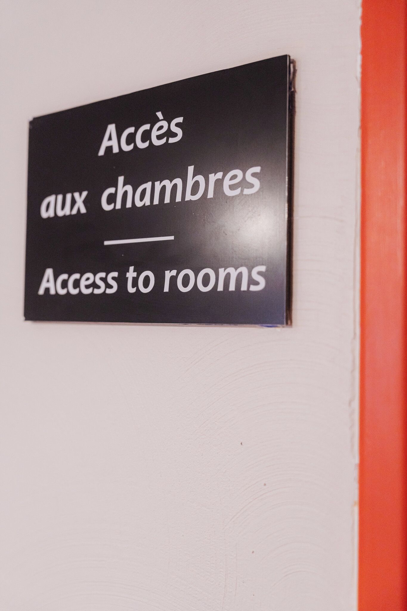 A sign indicating access to rooms.