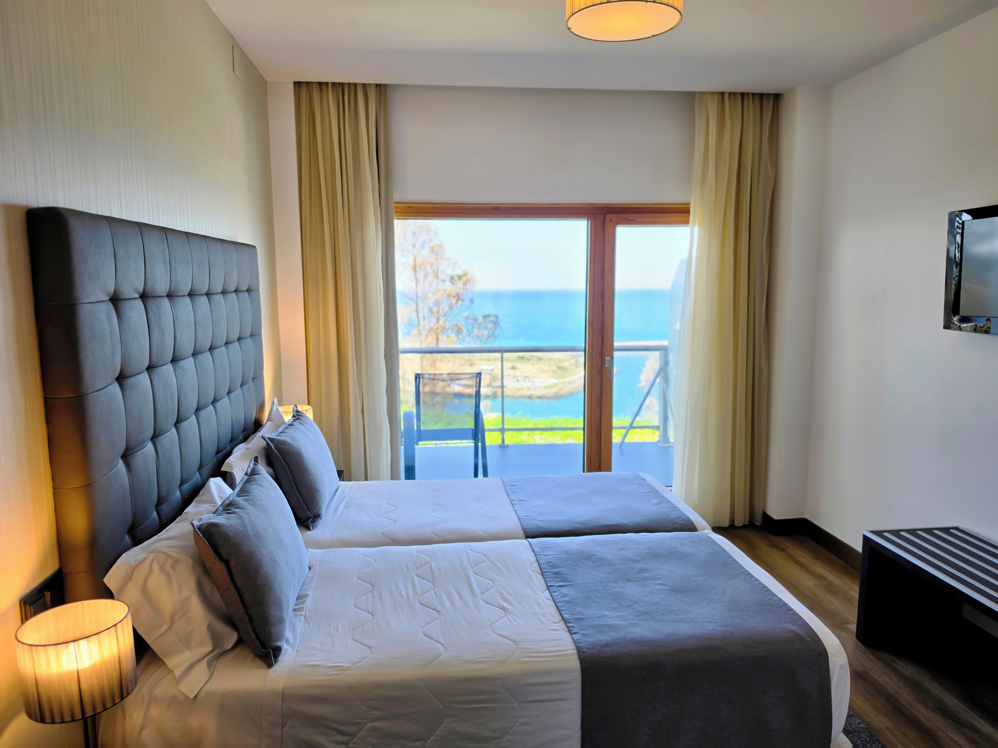Double or Twin Room, Sea View | Minibar, in-room safe, desk, blackout curtains