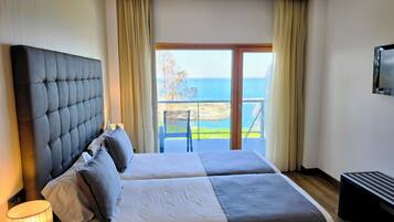 Double or Twin Room, Sea View | Minibar, in-room safe, desk, blackout curtains