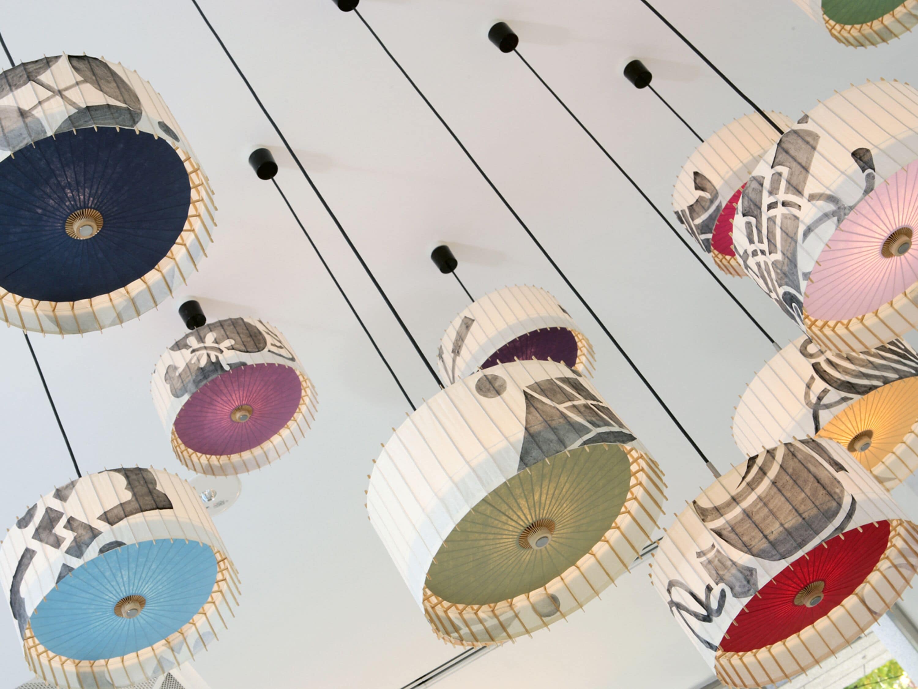 A ceiling with multiple hanging lamps.