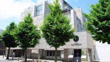 Experience the charm of The Green, a commercial establishment with a unique blend of glass and stone architecture.