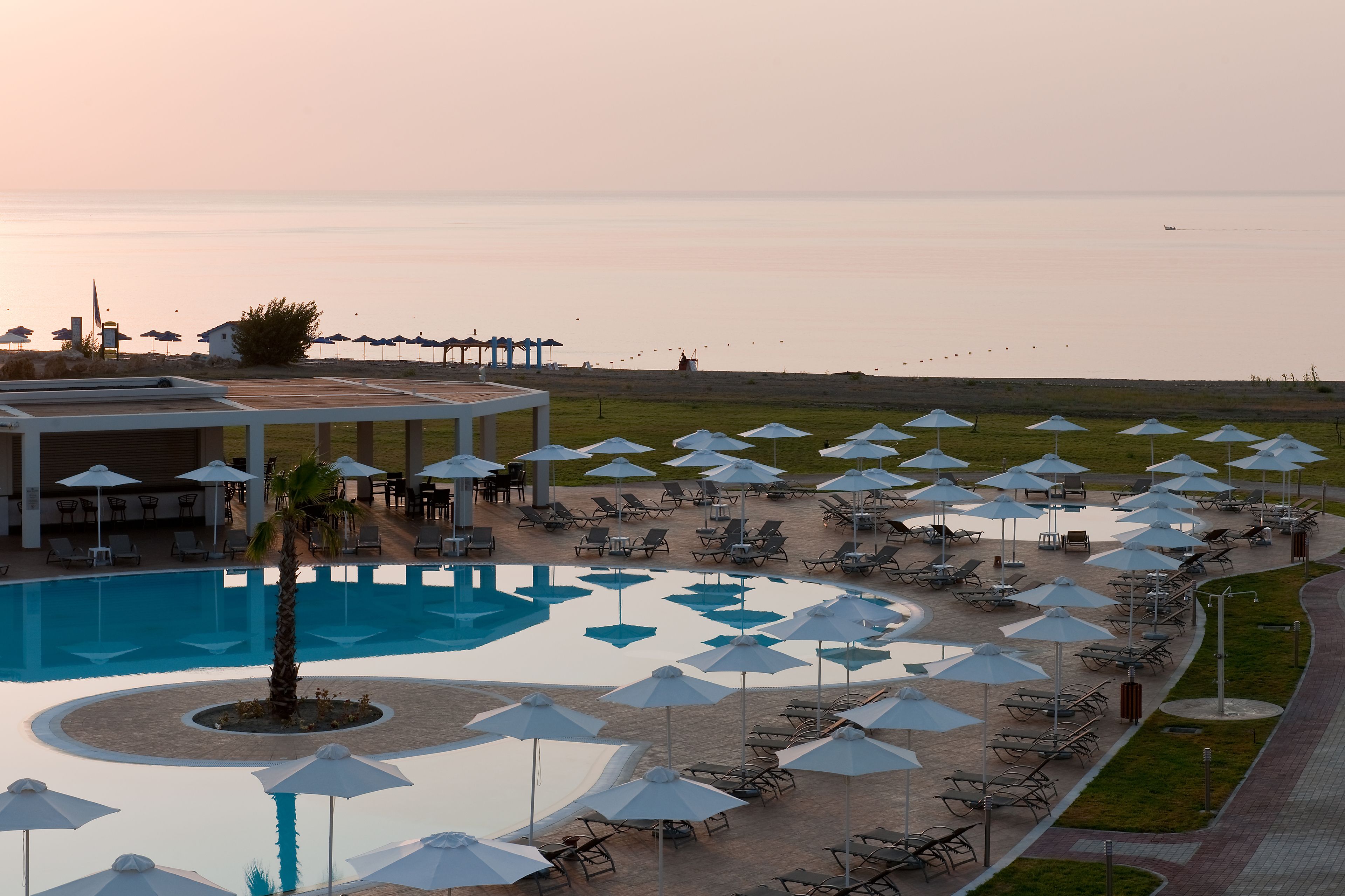 outdoor pool, open 9:00 am to 8:00 pm, pool umbrellas, pool loungers
