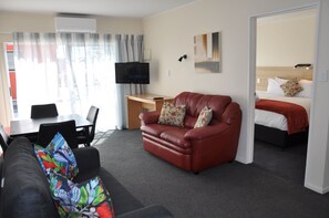 Two Bedroom | Living area | 32-inch flat-screen TV with satellite channels