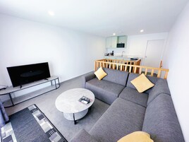 Family Apartment, 2 Bedrooms, Jetted Tub | Living area | 32-inch LED TV with cable channels, TV