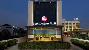 A hotel named "Best Western PLUS" with a modern facade, large windows, and a well-lit entrance. - Best Western Plus Indore (Indore)