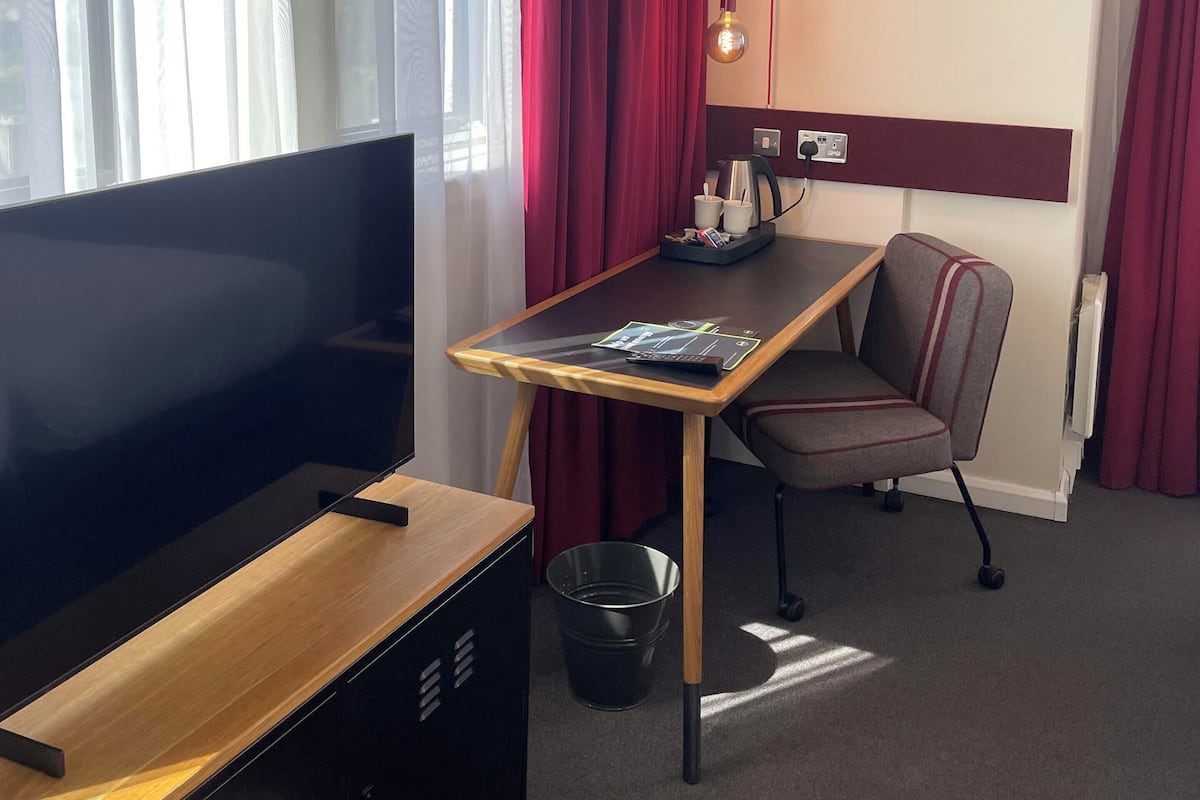 Desk, laptop workspace, blackout drapes, free WiFi