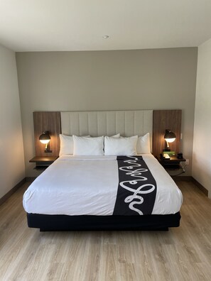 Premium bedding, desk, laptop workspace, blackout curtains