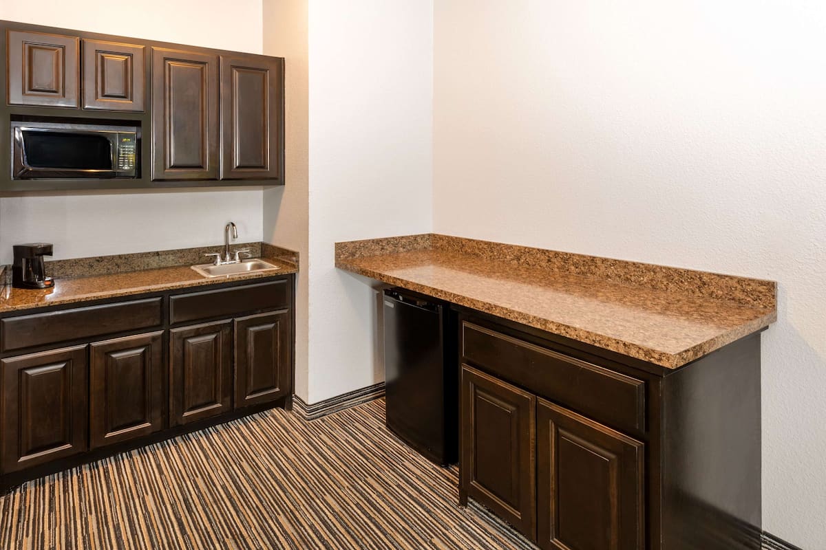 premium bedding, pillow-top beds, desk, laptop workspace