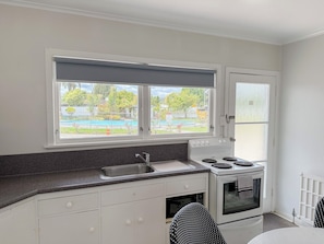 Pool View 2 Bedroom Apartment | Private kitchen | Fridge, microwave, stovetop, coffee/tea maker