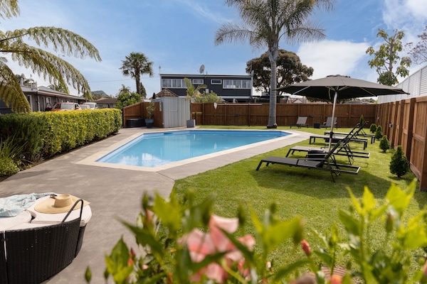 Outdoor pool, open 9:00 AM to 8:00 PM, pool umbrellas, pool loungers