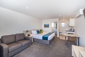 Deluxe Studio Suite, 1 King Bed | Living area | 50-inch Smart TV with digital channels, TV, toys - Taylors Motel (Ashburton)