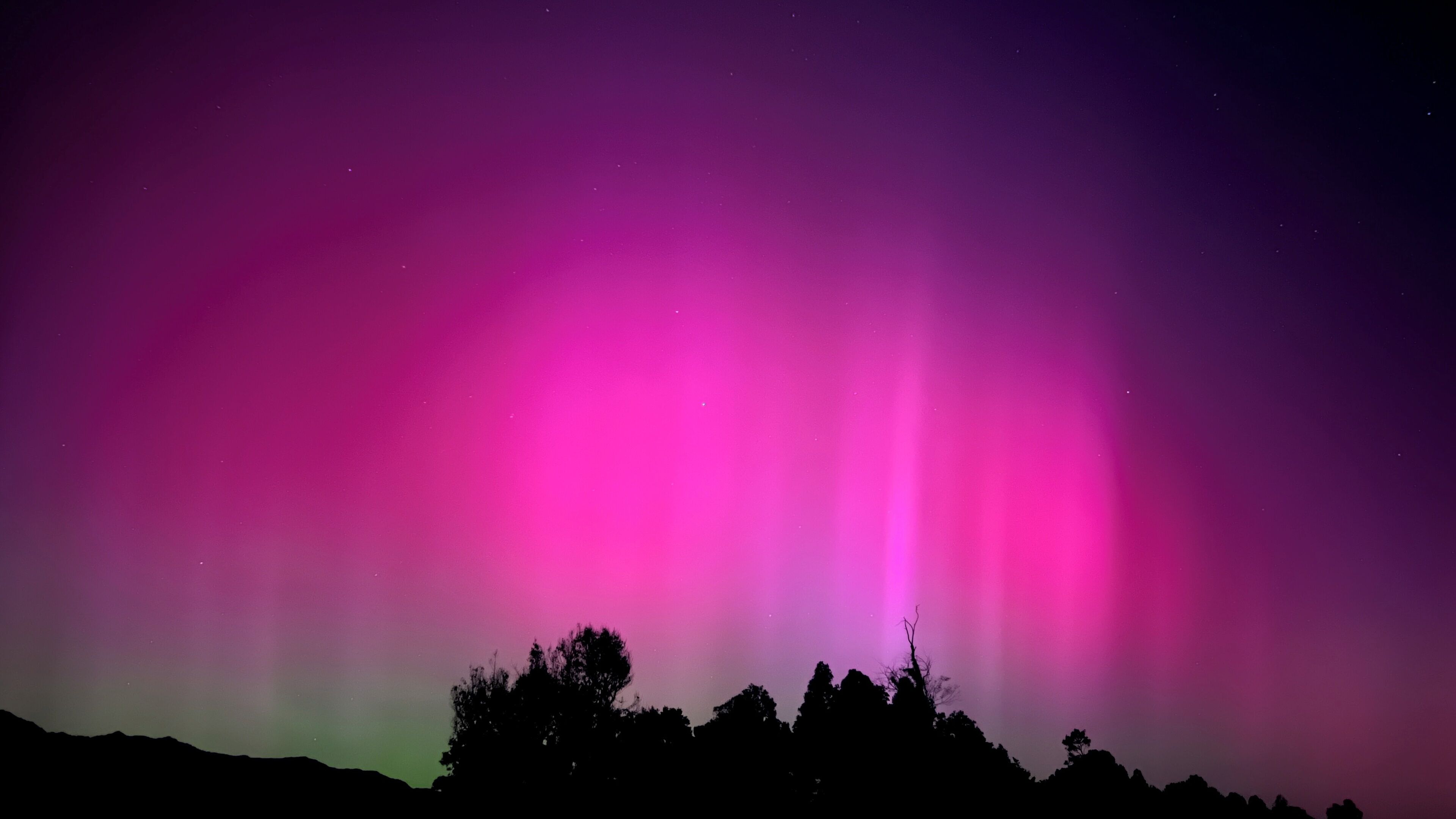 A night sky with the aurora borealis.