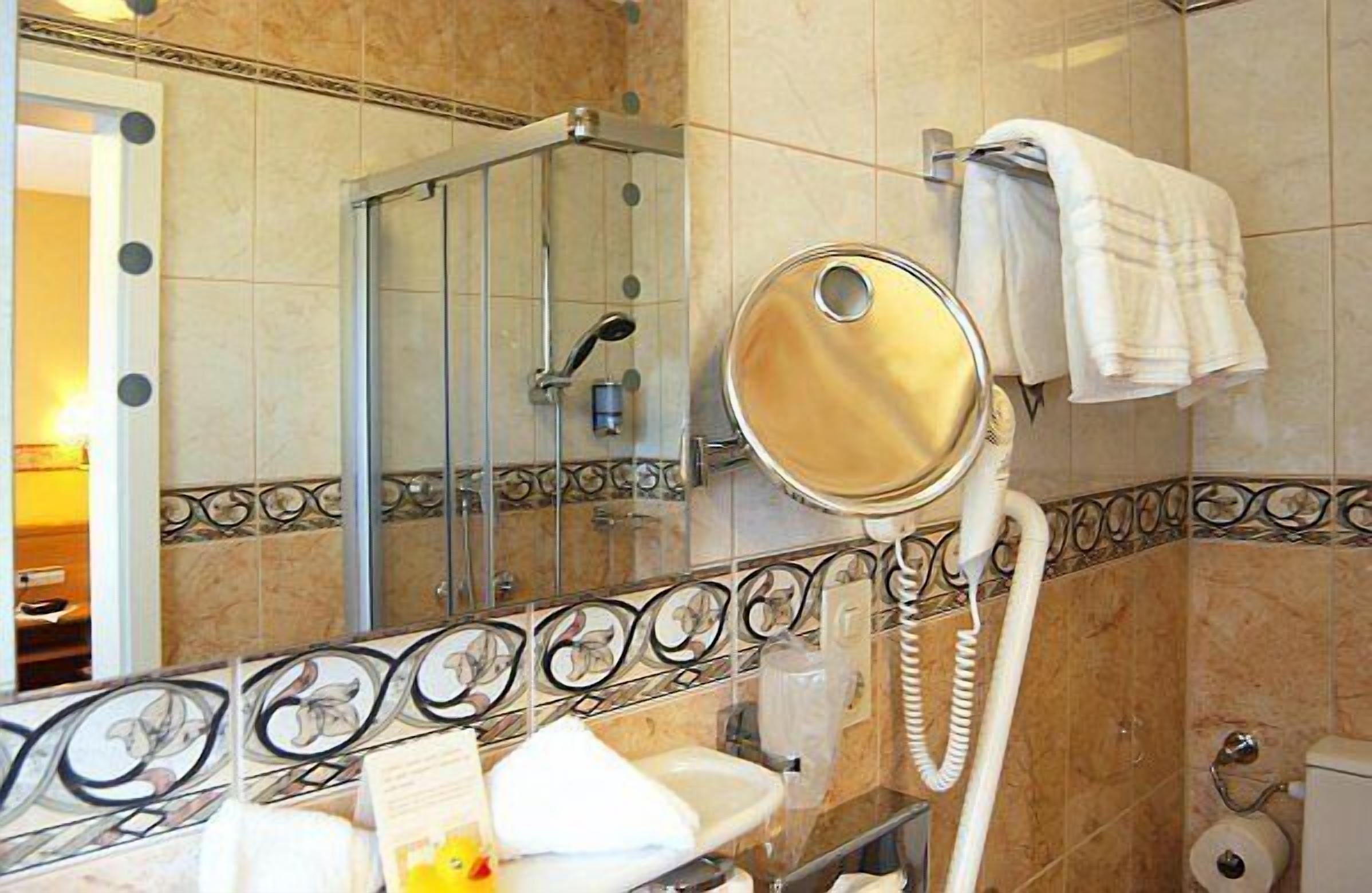 double room | bathroom | rainfall showerhead, designer toiletries, hair dryer, bathrobes