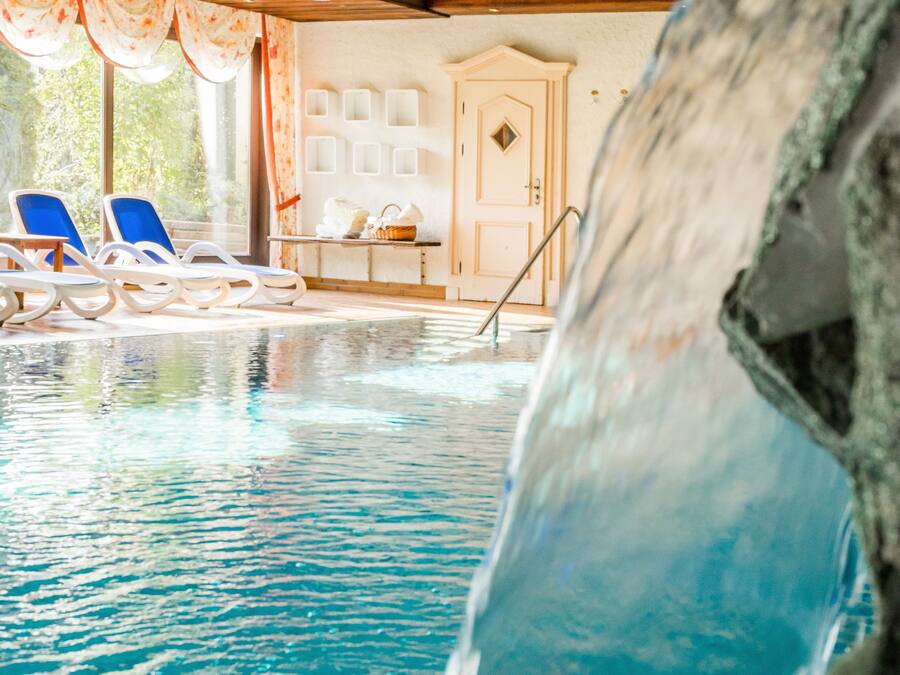 Indoor pool, pool umbrellas, sun loungers