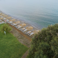 On the beach, sun-loungers, beach umbrellas, beach towels
