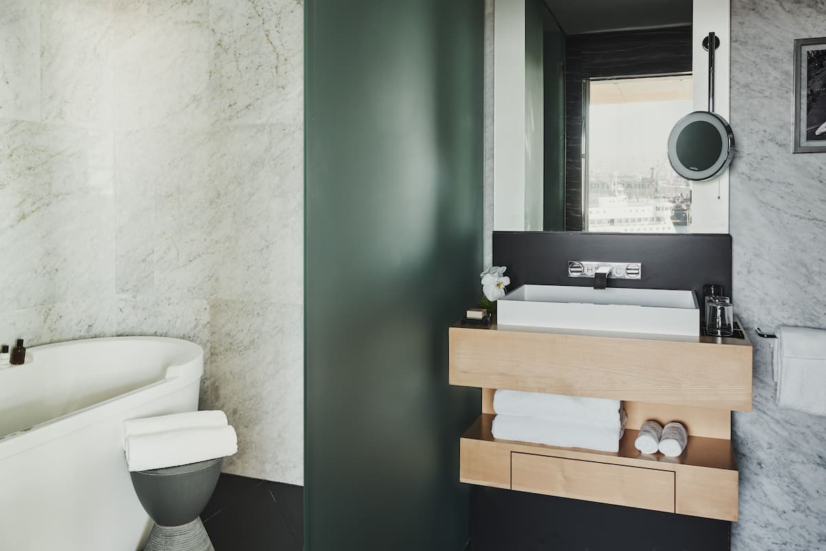 Bathroom | Designer toiletries, hair dryer, bathrobes, slippers
