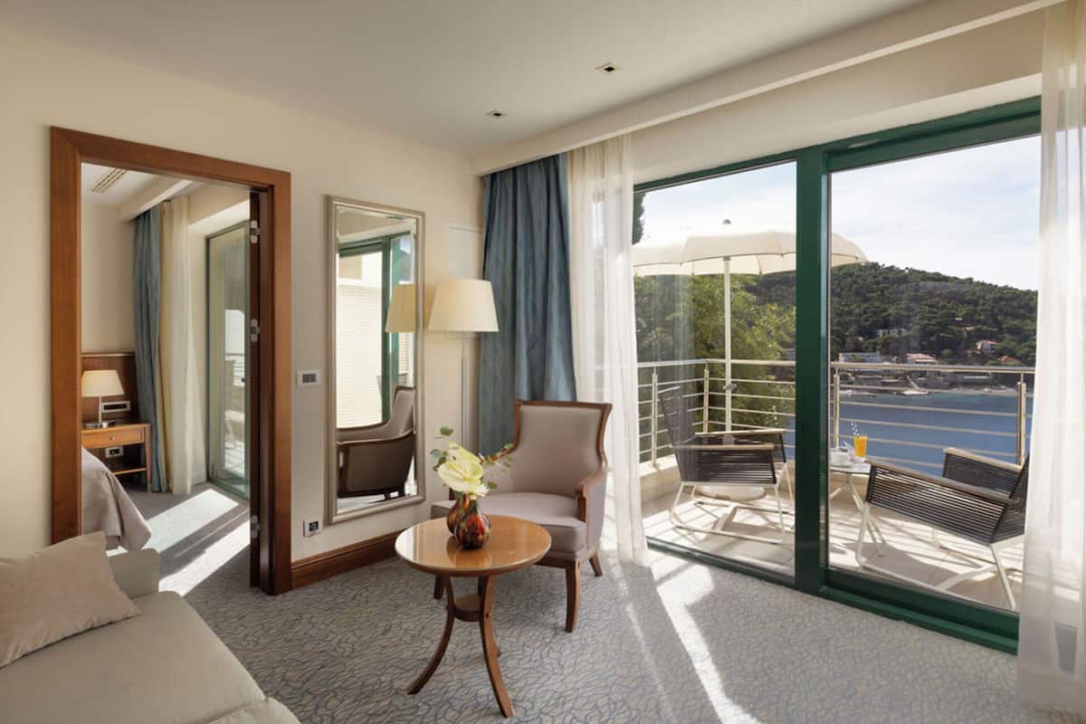 junior suite, 1 bedroom, balcony, partial sea view | living area | led tv, pay films