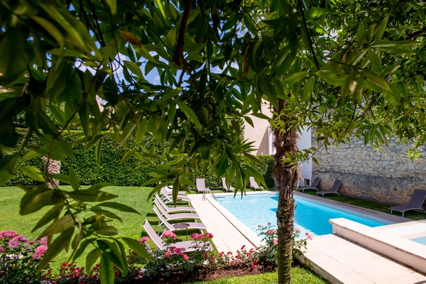 Seasonal outdoor pool, pool loungers