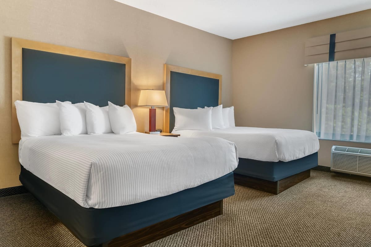 premium bedding, desk, blackout curtains, iron/ironing board