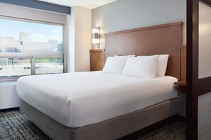 Hypo-allergenic bedding, down duvets, desk, laptop workspace