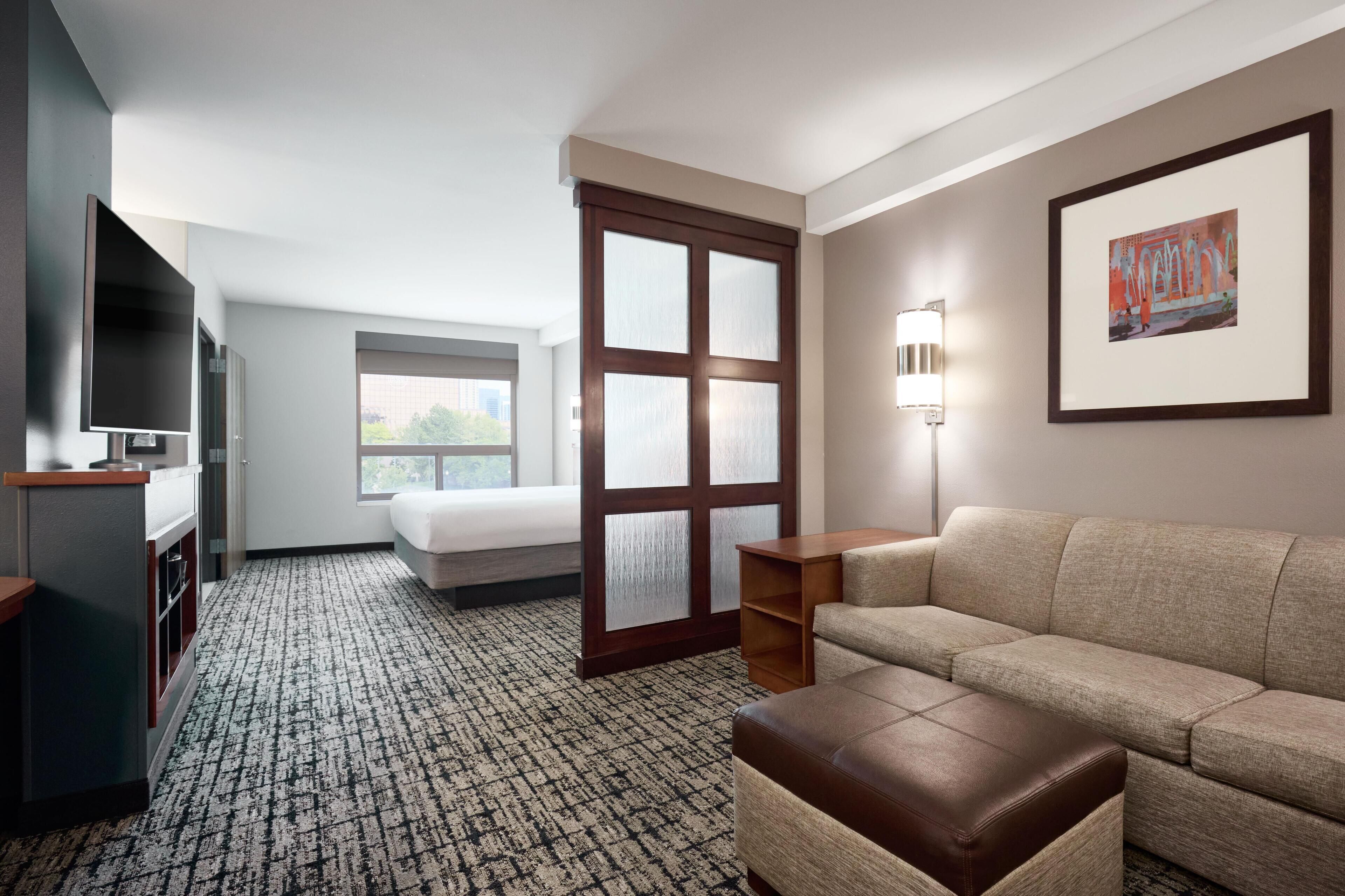 Hypo-allergenic bedding, down duvets, desk, laptop workspace