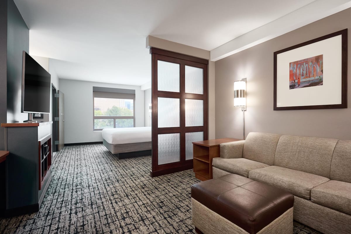 Hypo-allergenic bedding, down duvets, desk, laptop workspace