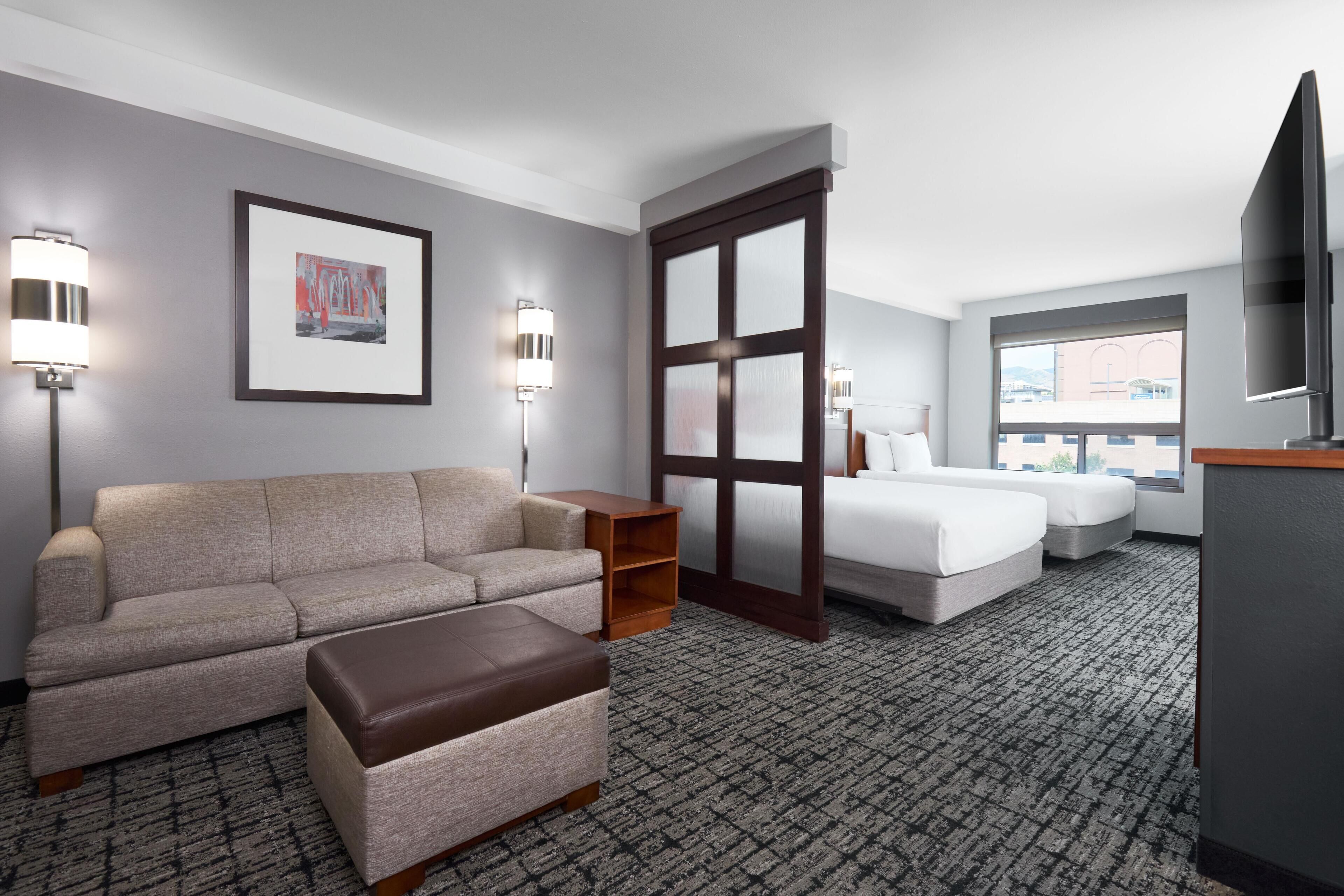 Hypo-allergenic bedding, down duvets, desk, laptop workspace