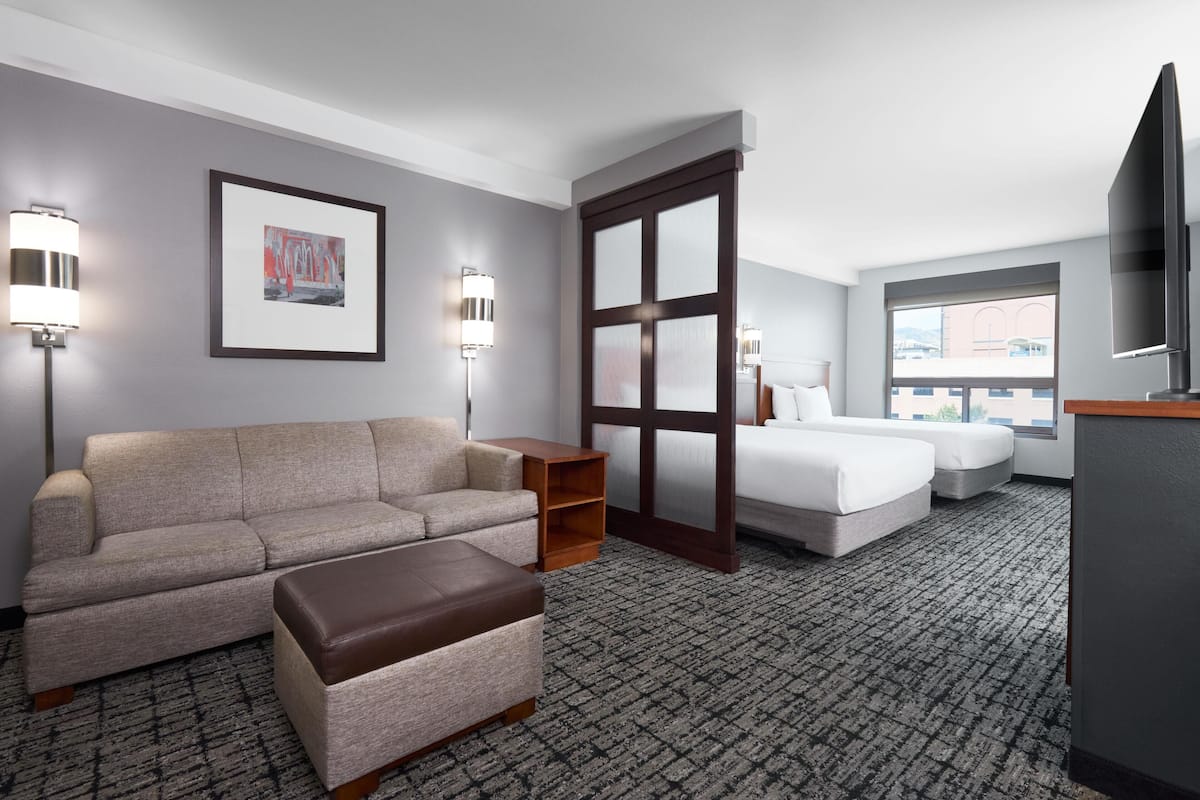 Hypo-allergenic bedding, down duvets, desk, laptop workspace