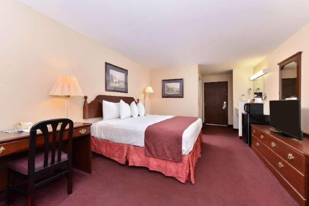 Desk, blackout drapes, iron/ironing board, rollaway beds