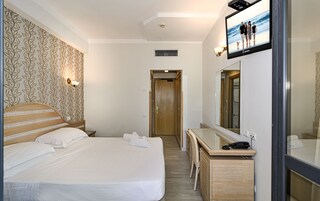 Standard Double or Twin Room | Minibar, in-room safe, desk, iron/ironing board
