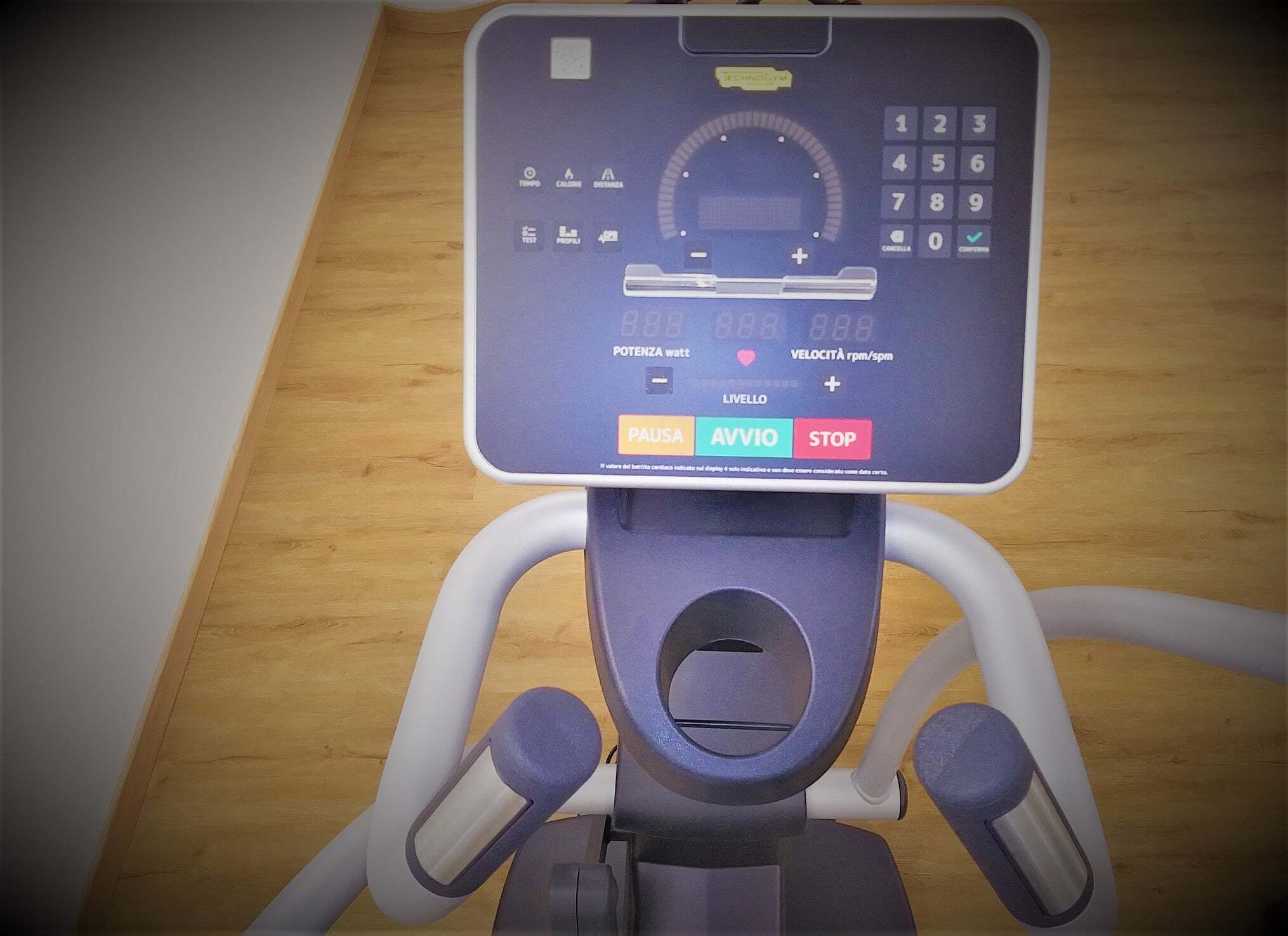 A stationary bike with a digital display and control panel.