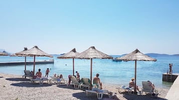 On the beach, white sand