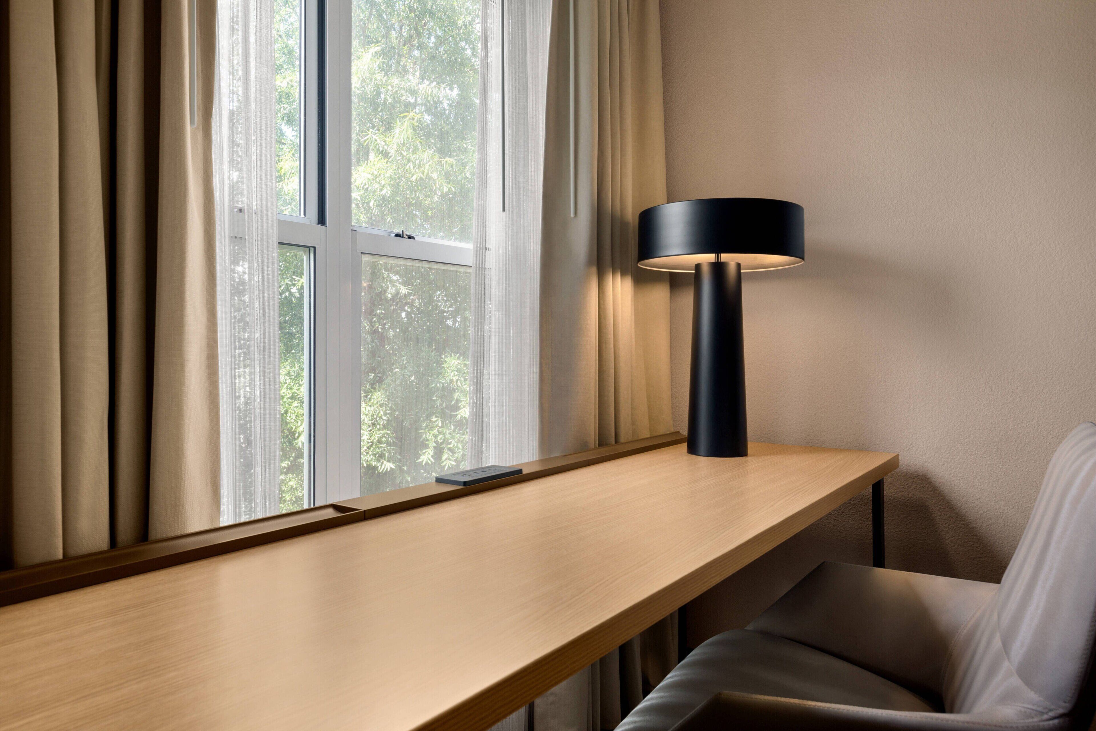 desk, blackout curtains, soundproofing, iron/ironing board