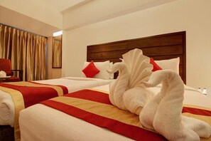 Egyptian cotton sheets, premium bedding, memory-foam beds, minibar - Monarch Luxur (Bengaluru)