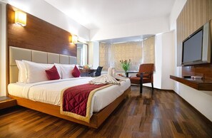 Egyptian cotton sheets, premium bedding, memory-foam beds, minibar - Monarch Luxur (Bengaluru)
