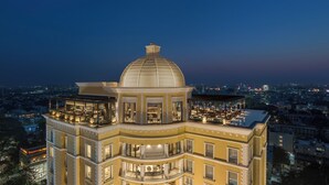 A multi-story hotel with a prominent dome and a rooftop terrace. - The Residency Towers (Chennai)