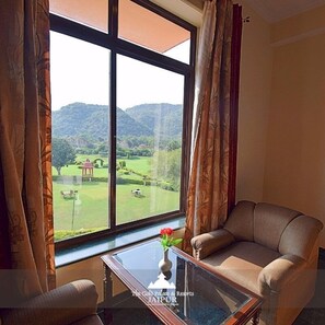 Deluxe Room | Living area | LED TV - The Gold Palace & Resorts (Amer)