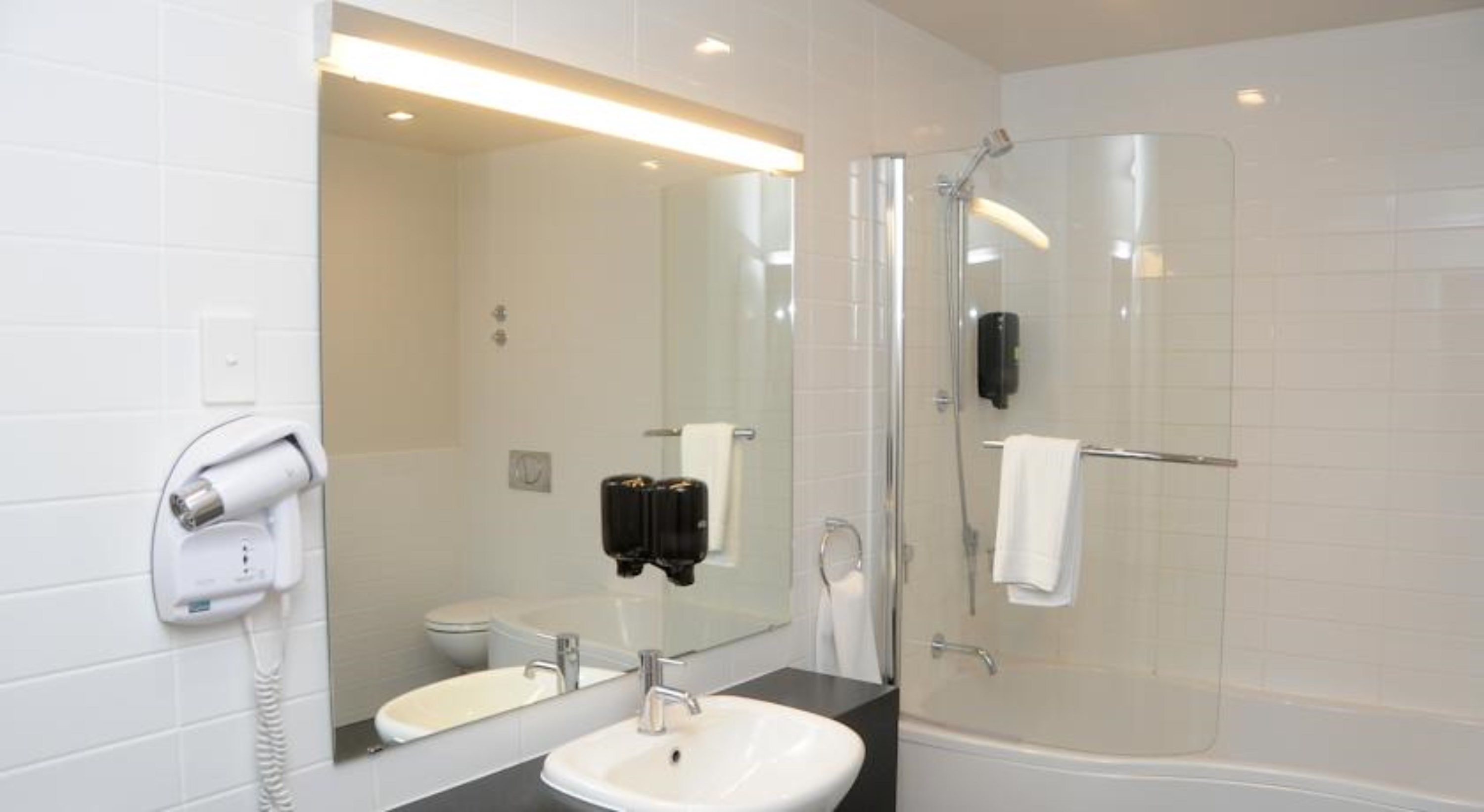 premium bedding, pillow-top beds, desk, blackout curtains