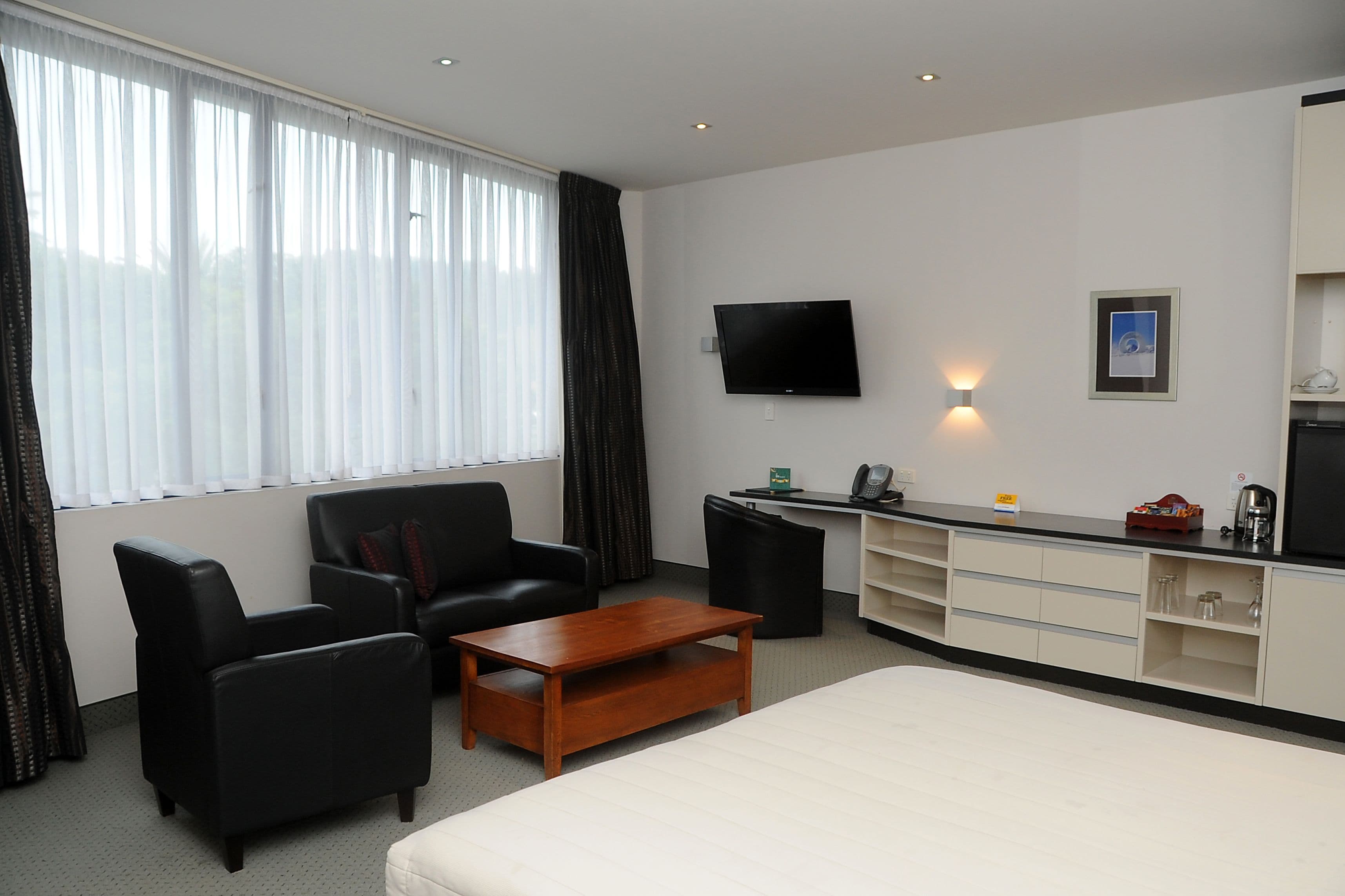 premium bedding, pillow-top beds, desk, blackout curtains