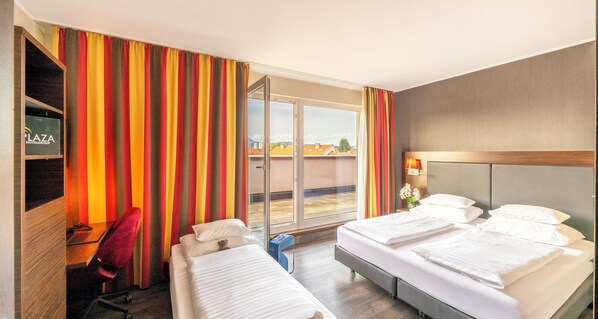 Triple Room | In-room safe, desk, laptop workspace, blackout drapes