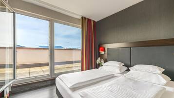 In-room safe, laptop workspace, blackout drapes, soundproofing