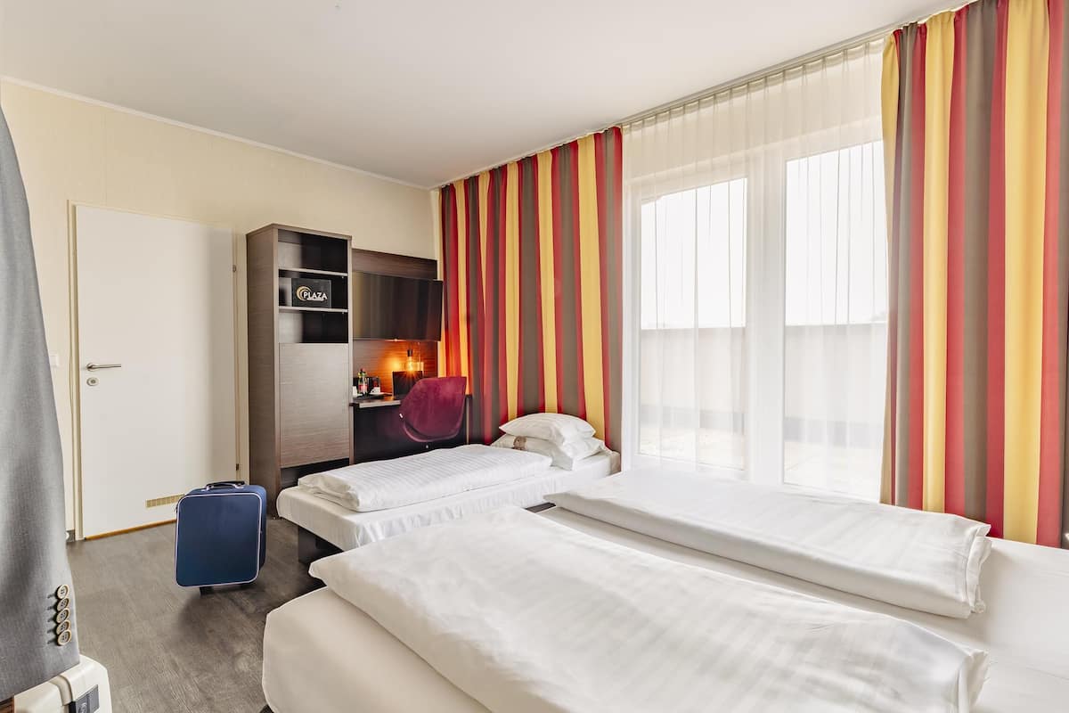 comfort room, multiple beds | in-room safe, laptop workspace, blackout curtains, soundproofing