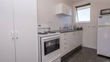 1 Bedroom Apartment | Private kitchen | Microwave, stovetop, electric kettle, toaster