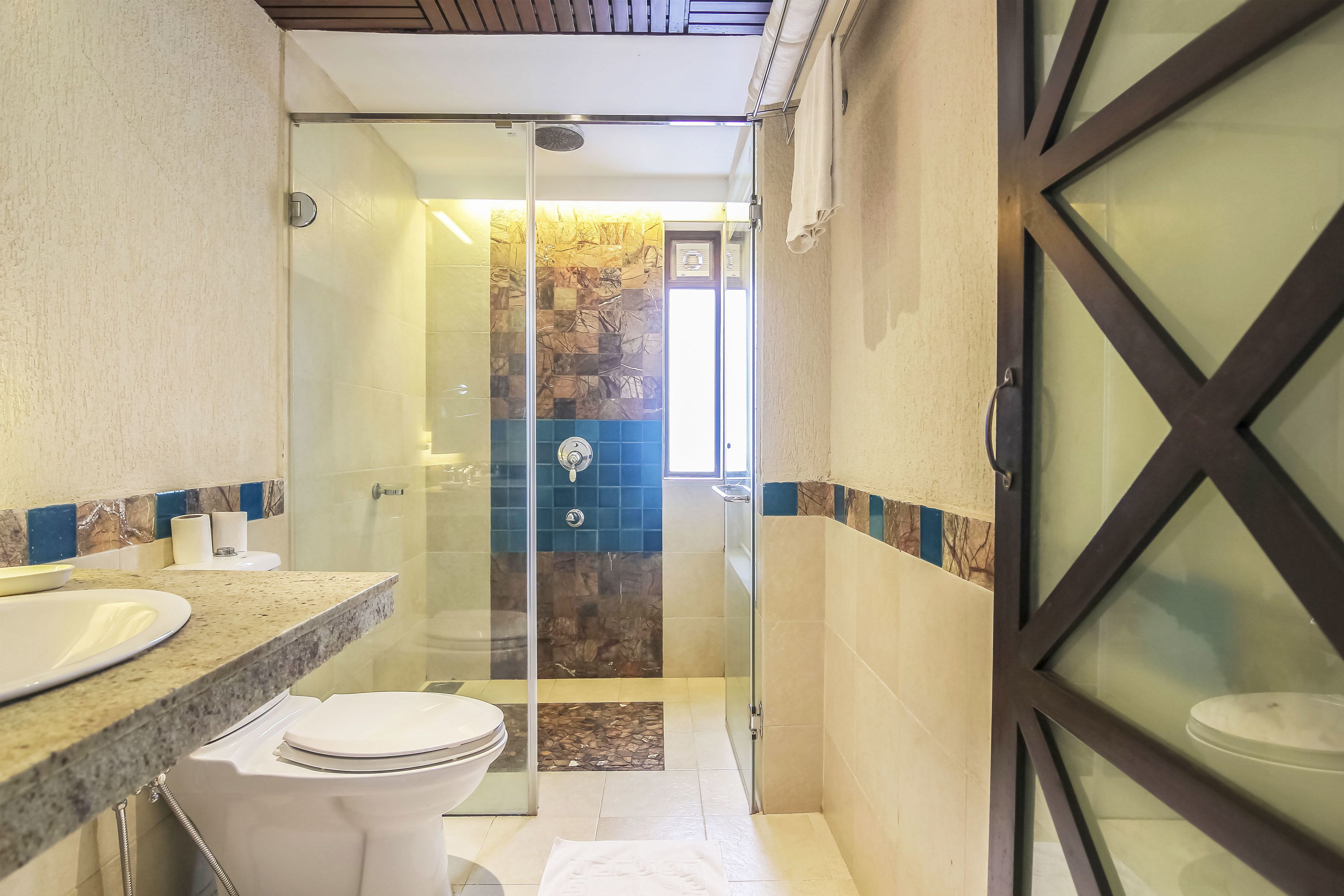 suite | bathroom | shower, hair dryer, towels