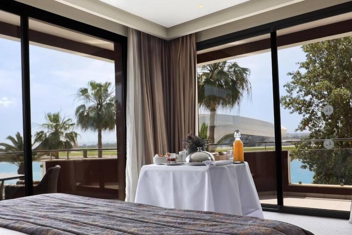 premium suite (river view) | 1 bedroom, minibar, in-room safe, individually decorated