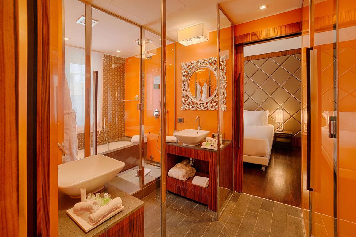 combined shower/bathtub, deep-soaking bathtub, rainfall showerhead