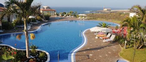 Outdoor pool, pool umbrellas, pool loungers