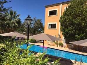 Outdoor pool, pool umbrellas, pool loungers
