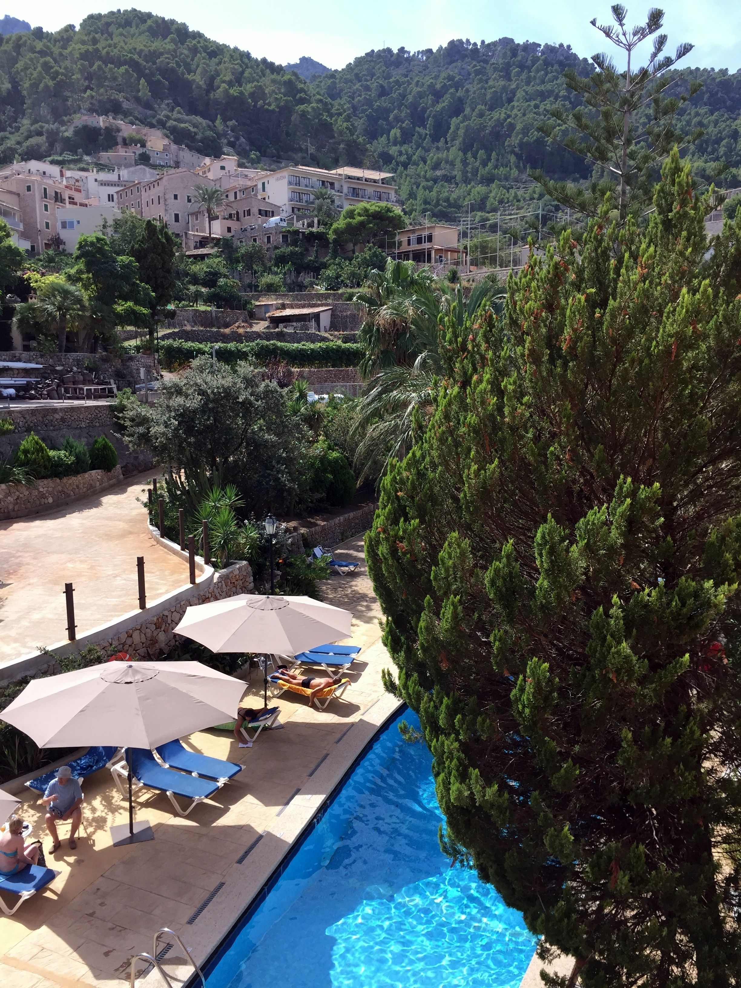 outdoor pool, pool umbrellas, pool loungers